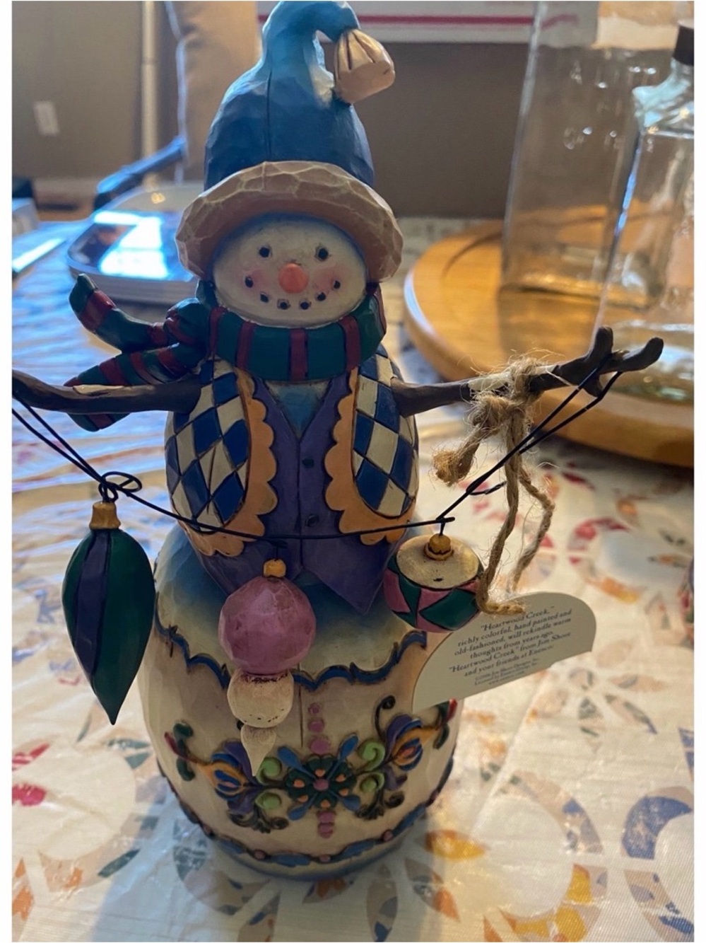 Jim Shore Blue Hat Snowman Figurine with Multicolor Ornament Garland